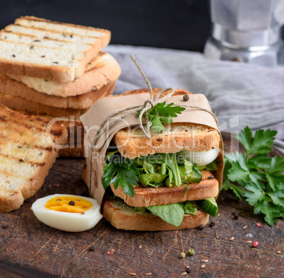 sandwich of French toast and lettuce leaves and boiled egg