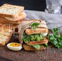 sandwich of French toast and lettuce leaves and boiled egg