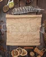 empty rolled brown paper sheet on a wooden background