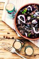 Marinated mushrooms in ceramic bowl