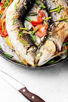 Baked fish in a pan