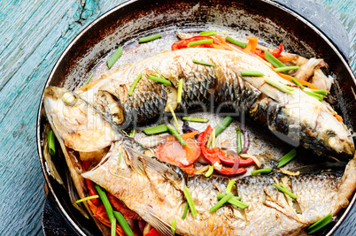 Baked fish in a pan