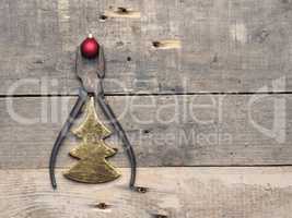 Old pliers with Christmas bauble