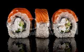 Three pieces of sushi rolls Philadelphia