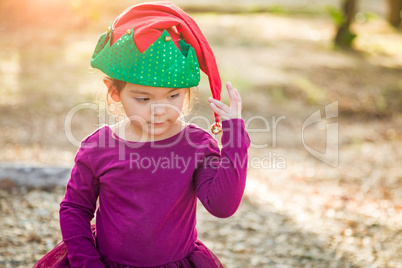 Cute Mixed Race Young Baby Girl Having Fun Wearing Christmas Hat