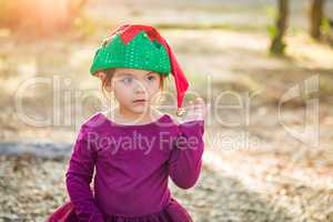 Cute Mixed Race Young Baby Girl Having Fun Wearing Christmas Hat