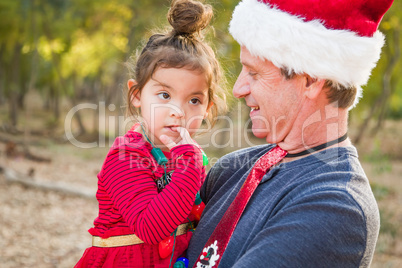 Festive Grandfather and Mixed Race Baby Girl Outdoors