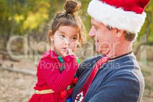 Festive Grandfather and Mixed Race Baby Girl Outdoors