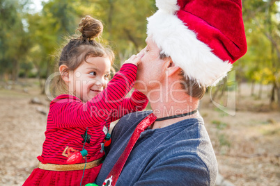 Festive Grandfather and Mixed Race Baby Girl Outdoors