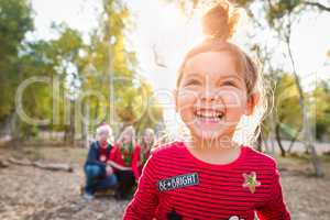 Cute Mixed Race Baby Girl Christmas Portrait With Family Behind