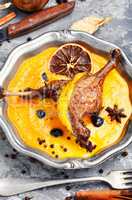 Baked duck leg in pumpkin puree