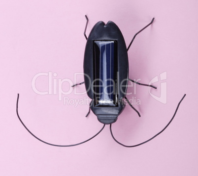 Electronic Bug Toy on Pink Background