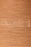Tan textured bamboo fabric background