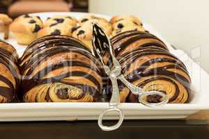 Flakey Chocolate Croissant grouped on a plate in a bakery fresh