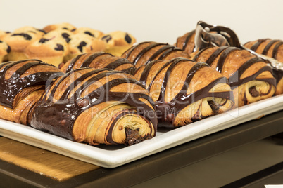 Flakey Chocolate Croissant grouped on a plate in a bakery fresh