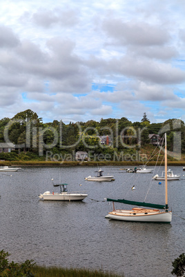 Sailboats and fishing boats anchor in a harbor in New Orleans on