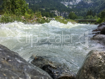 Rough mountain river in the Swiss Alps, Grindelwald, Europe.