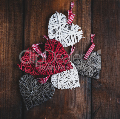 wicker small hearts on a brown wooden background