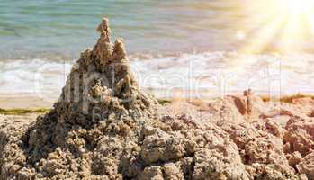 large pile of wet sand on the beach