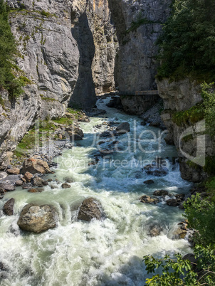Rough mountain river in the Swiss Alps, Grindelwald, Switzerland