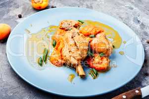Chicken meat in apricot sauce