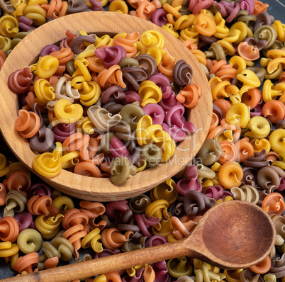 multicolored spiral raw pasta fusilli