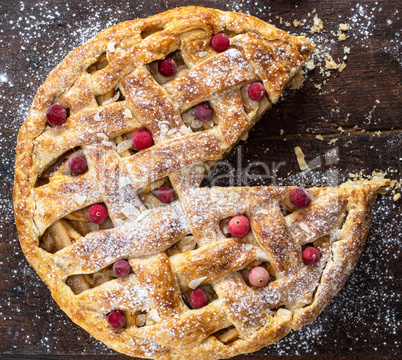 round baked apple pie, cut into a triangular piece