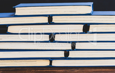 stack of books with yellow pages