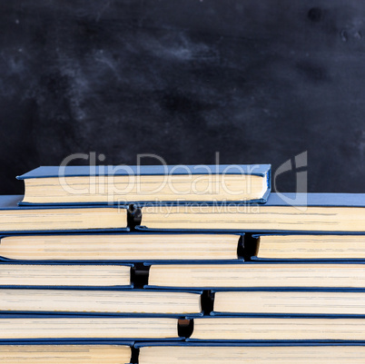 stack of books with yellow pages