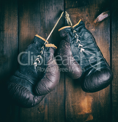 pair of very old brown boxing gloves