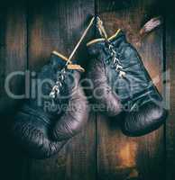 pair of very old brown boxing gloves