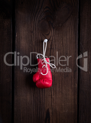 one leather red boxing glove with laces
