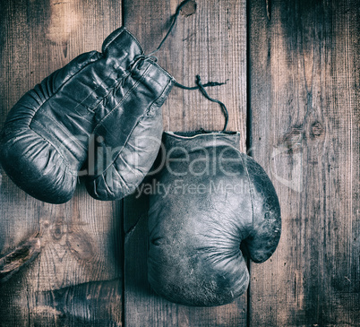 very old black boxing gloves