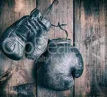 very old black boxing gloves