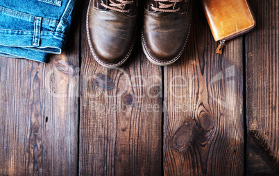 pair of leather brown shoes, wallet and jeans