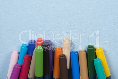 pen tip pens on blue background and with space for text