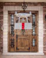 Unmanned Aircraft System (UAV) Quadcopter Drone Delivering Box