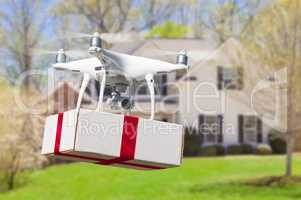 Unmanned Aircraft System (UAV) Quadcopter Drone Delivering Box
