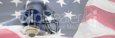 Composite image of close-up of sports helmet and football