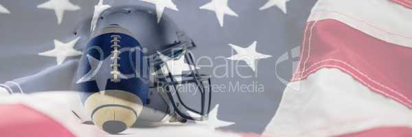 Composite image of close-up of sports helmet and football