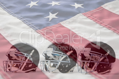 Composite image of close up of black sports helmets arranged side by side