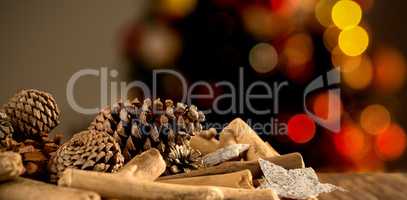Composite image of christmas decorations on wooden table