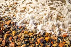 surf of the Balti sea on pebbles