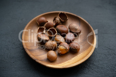 chestnuts on wooden plate