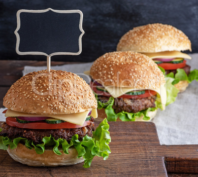 hamburger with meat patty and fresh vegetables