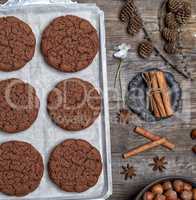 round chocolate cookies on an iron plate