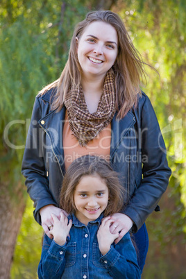 Affectionate Caucasian Mother and Mixed Race Daughter Portrait