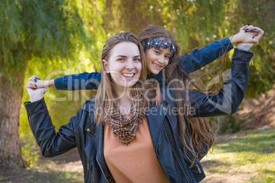 Affectionate Caucasian Mother and Mixed Race Daughter Portrait