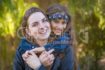 Affectionate Caucasian Mother and Mixed Race Daughter Portrait