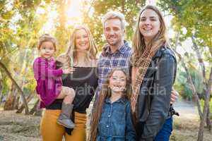 Mixed Race Family Members Having Fun Outdoors